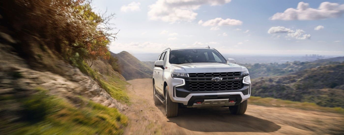 A white 2021 Chevy Tahoe going to see a used Chevy Tahoe for sale.