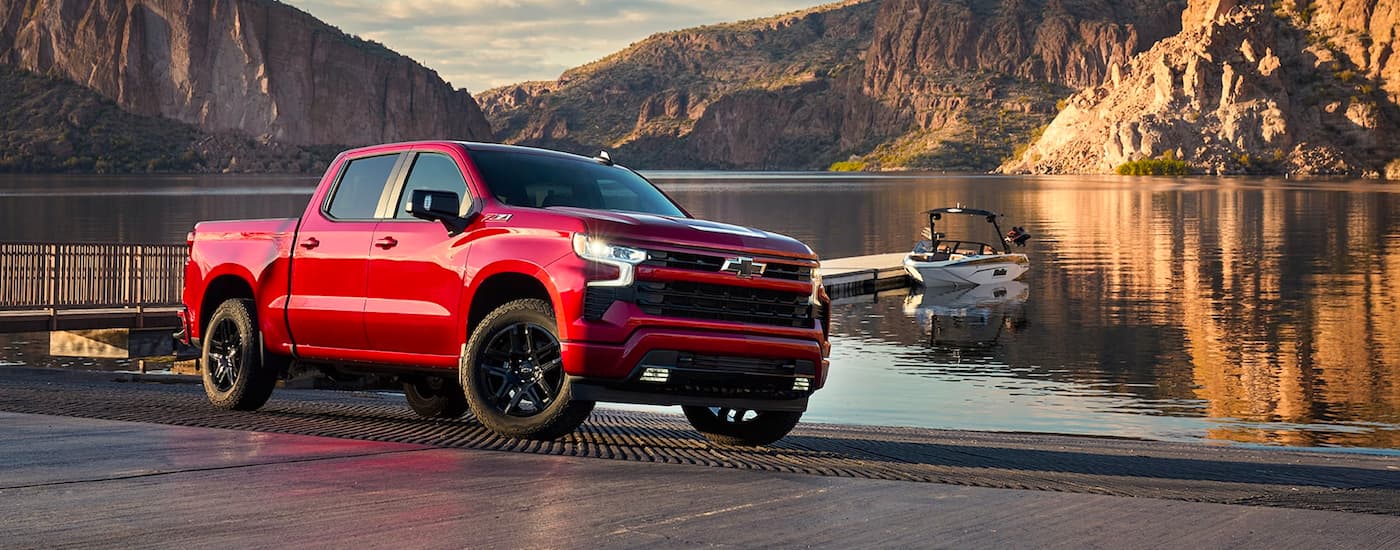 Red 2022 Chevy Silverado 1500 parked by a lake