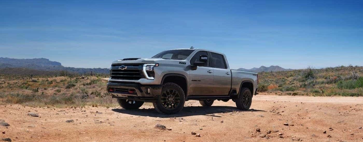 A gray 2025 Chevy Silverado 2500 HD ZR2 parked off-road.