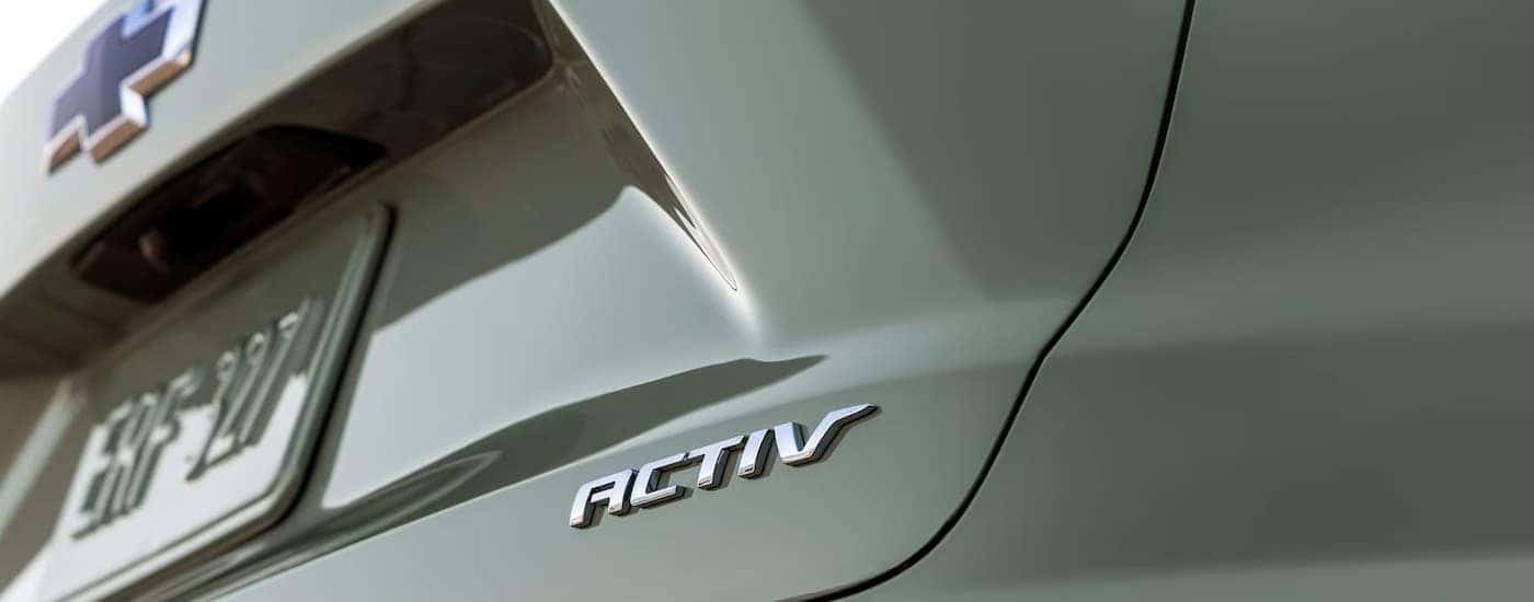 A close up of the rear of a green 2024 Chevy Trax ACTIV.