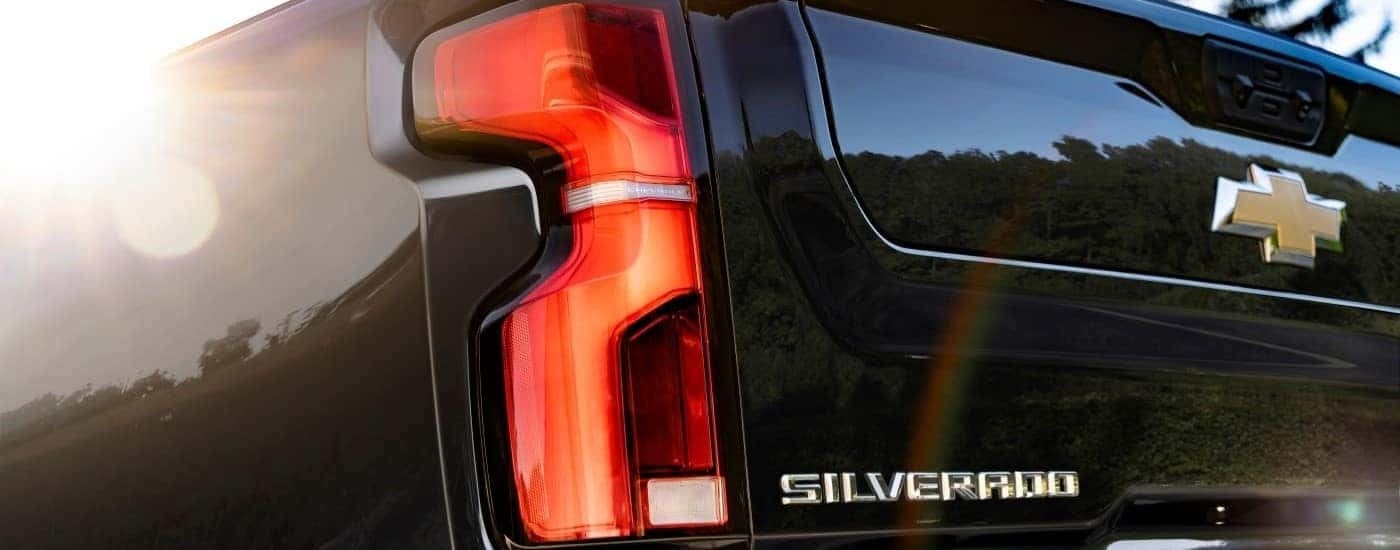 Driver side taillight on a black 2024 Chevy Silverado 2500HD High Country.