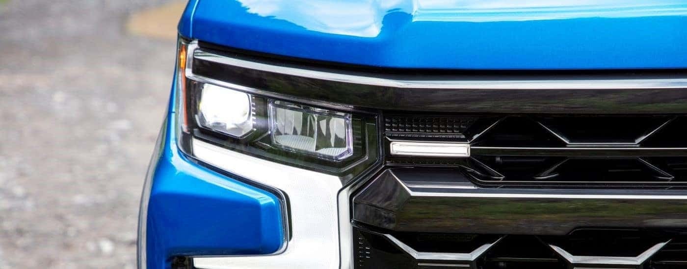 Passenger side headlight on a blue 2023 Chevy Silverado 1500 ZR2.