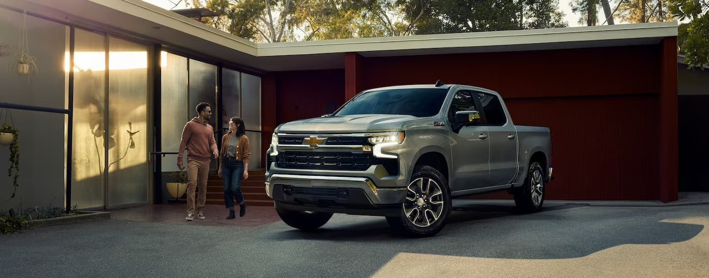 A silver 2023 Chevy Silverado 1500 Z71 is shown parked on a driveway.